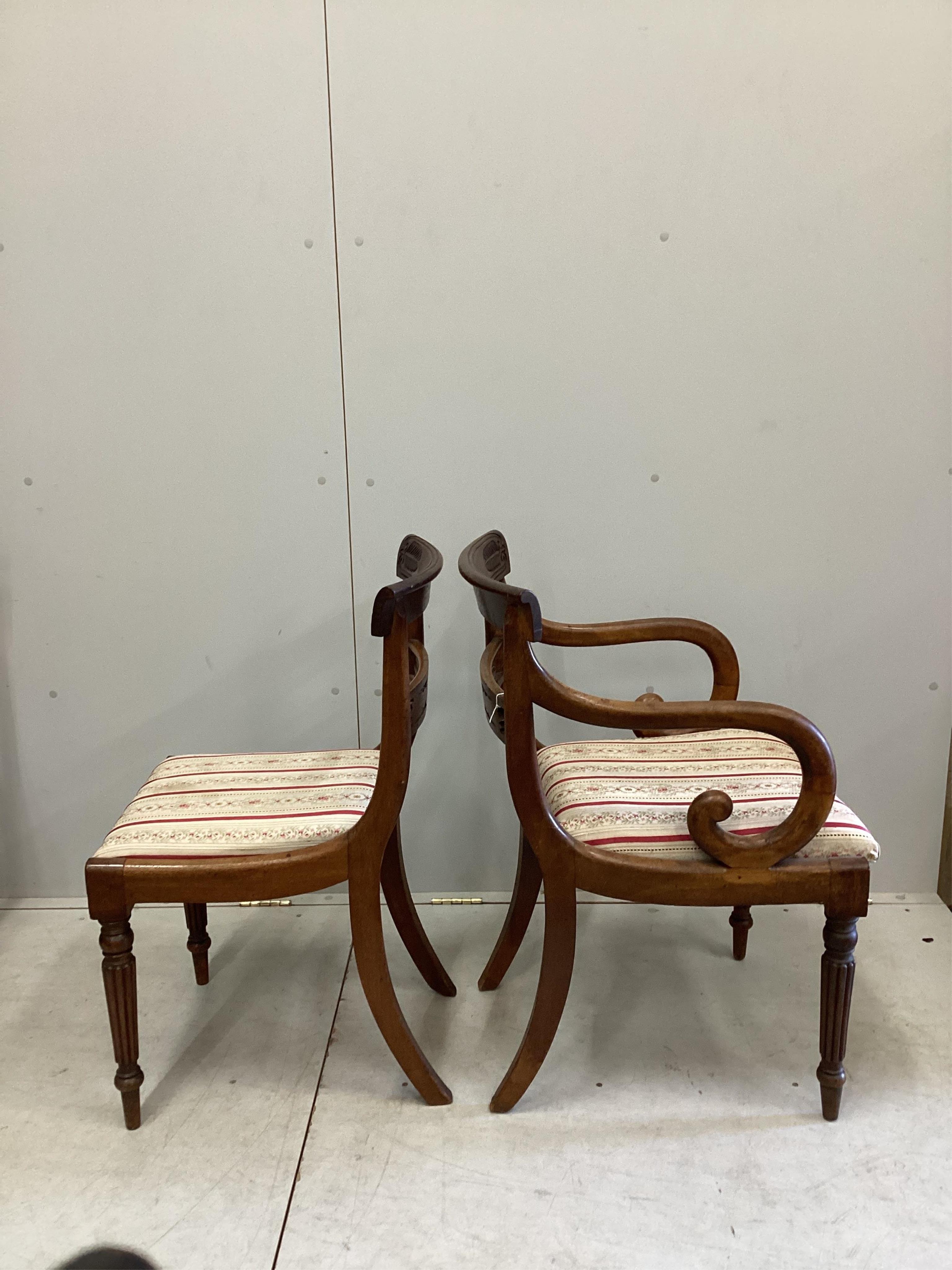 A set of six Regency mahogany dining chairs, two with arms